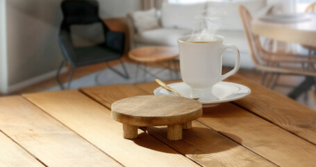Coffee on the table in the morning and the rays of the sun with a free space