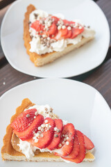 A beautiful dessert of sponge cake and cream with strawberries