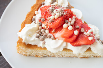 A beautiful dessert of sponge cake and cream with strawberries