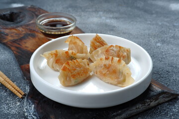  Gyoza or Jiaozi or mandu, asian dumpling with Dipping Sauce