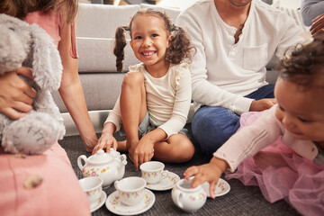 Happy, kids and children at play date have tea party, fun and playing together on home living room floor. Development, youth and group of little girl friends imagine theyre a princess at royal party