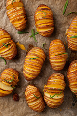 baked hasselback potato with cheddar cheese and rosemary