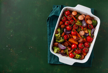 oven baked vegetables and sausages, healthy lunch, sweet potato onion tomato broccoli