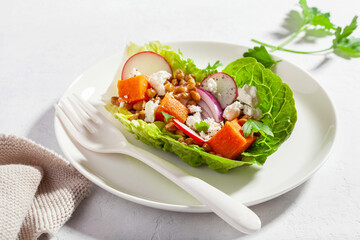 healthy sweet potato lettuce boats with radish, feta cheese, lentils