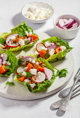 healthy sweet potato lettuce boats with radish, feta cheese, lentils