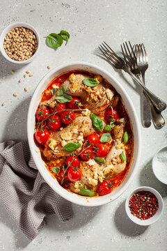 chicken legs backed with feta cheese tomatoes and pine nuts, healthy meal