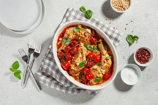 chicken legs backed with feta cheese tomatoes and pine nuts, healthy meal