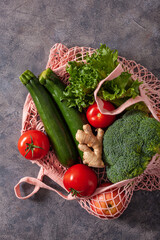 fruits vegetables in reusable mesh cotton bag, plastic free zero waste concept