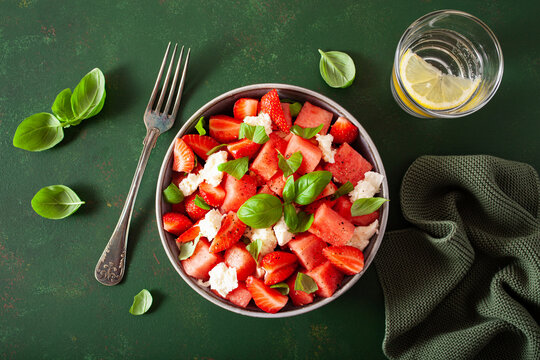 watermelon salad with strawberry mozzarella cheese basil. healthy summer dessert
