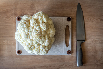 Ripe cauliflower head and knife