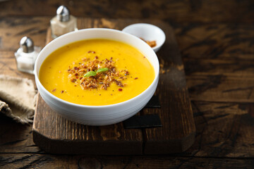 Traditional pumpkin soup with crunchy onion