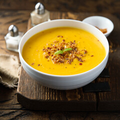 Traditional pumpkin soup with crunchy onion