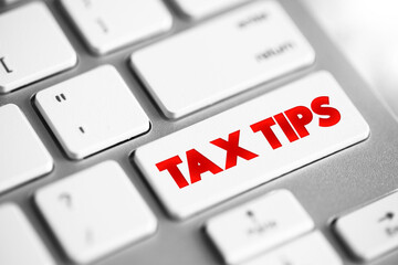 Tax Tips text button on keyboard, business concept background