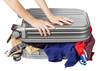 Travel suitcase full of things. Packing a suitcase for a trip.