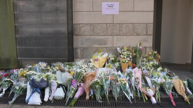 Flower bouquets are seen outside the British Consulate General as a tribute after the passing of the longest-serving monarch Queen Elizabeth II.