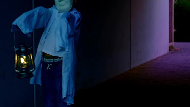 zombie, monster, ghost child 10 years old in white hoodie in creepy tunnel, boy ghost walks at night, halloween concept, frightening mystical events, friday 13th, horror movie scene