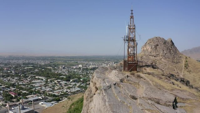 View of the city of Osh from a bird's eye view. The amazing nature of Kyrgyzstan. Sulaiman-Too is a rocky sacred mountain and a symbol of the city of Osh. Beautiful powerful mountains.