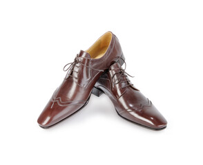 Leather brown male shoes on white background.