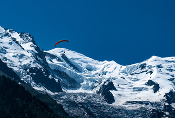 paraglider against the backdrop of the Mont Blanc massif in the French Alps, Chamonix