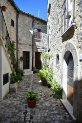 A narrow street between the old stone houses of Barrea, a medieval village in the Abruzzo region of Italy.