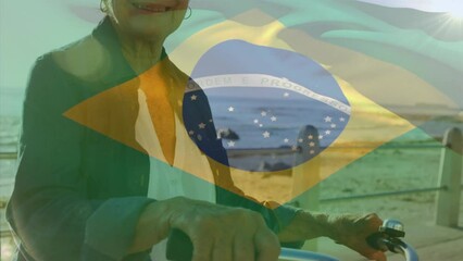 Animation of flag of brazil over senior caucasian woman - Powered by Adobe