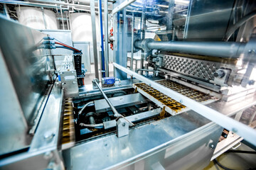 Production of chocolates. Sweets food factory automated industrial line