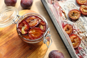 plum dried in the oven with spices and garlic for harvesting for the winter in jars delicacy