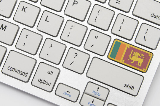 national flag of sri lanka on the keyboard on a grey background .3d illustration