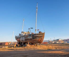 Abandoned old fishing boat on the coast of the Arctic Ocean at Iqaluit, Nunavut