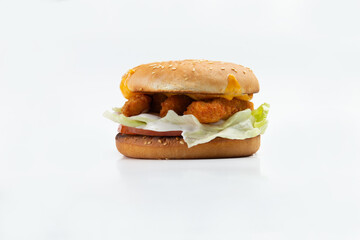 Hamburger with chicken strips and salad.