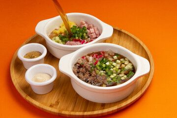 Traditional cold okroshka soup. With meat and sausage.