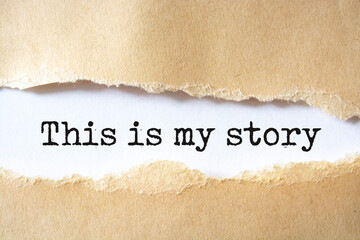 My story symbol. Words 'this is my story' appearing behind torn brown paper.
