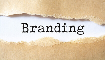 Torn paper with word Branding