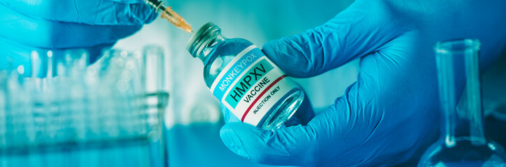 fills a syringe with monkeypox vaccine, web banner