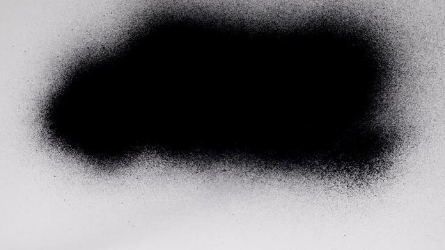 Black spray paint on a white background. Overlay.