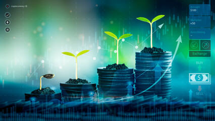 Stacking of coins with plants growing on top for financial and business background. Savings and...