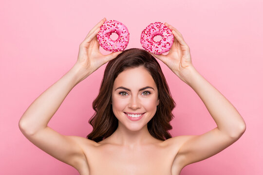 Photo of funny adorable young woman naked shoulders mickey mouse donuts isolated pink color background