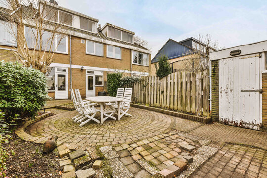 Neat patio with sitting area - Powered by Adobe