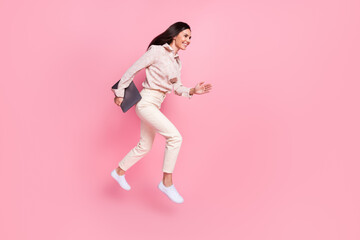 Fototapeta na wymiar Full body photo of cheerful agent lady jump hurry for eshop discounts isolated on pastel color background