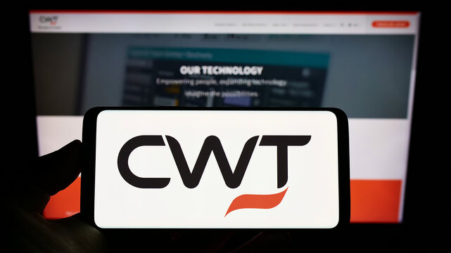 Stuttgart, Germany - 09-10-2022: Person holding smartphone with logo of travel management company CWT Global B.V. on screen in front of website. Focus on phone display.