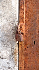 Rusted padlock on a tomb in La Recoleta Cemetery in Buenos Aires, Argentina