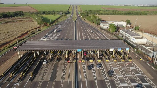 Ribeir&atilde;o Preto, S&atilde;o Paulo / Brazil - Circa June 2022: Highway toll plaza and speed limit with aerial image, view of automatic payment lanes, non-stop.