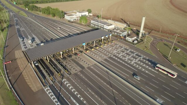 Ribeir&atilde;o Preto, S&atilde;o Paulo / Brazil - Circa June 2022: Highway toll plaza and speed limit with aerial image, view of automatic payment lanes, non-stop.