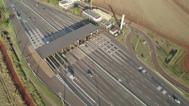 Ribeir&atilde;o Preto, S&atilde;o Paulo / Brazil - Circa June 2022: Highway toll plaza and speed limit with aerial image, view of automatic payment lanes, non-stop.