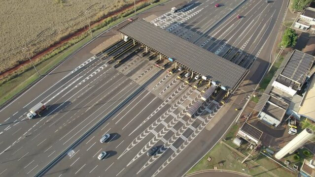 Ribeir&atilde;o Preto, S&atilde;o Paulo / Brazil - Circa June 2022: Highway toll plaza and speed limit with aerial image, view of automatic payment lanes, non-stop.