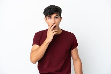 Young Argentinian man isolated on white background surprised and shocked while looking right