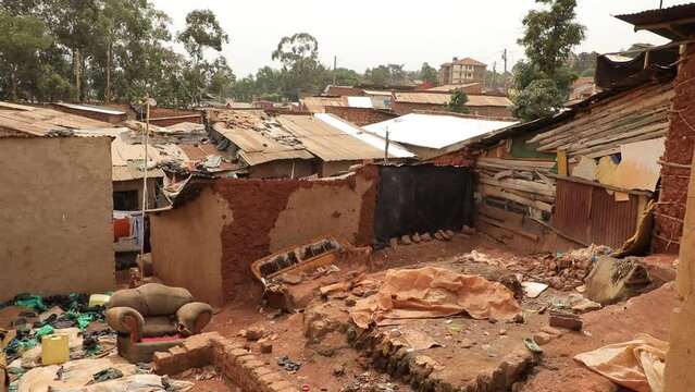 African slum street, very poor district Uganda Kampala, house ruins and poverty...