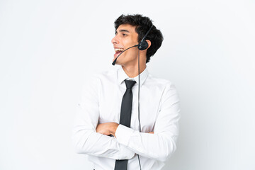 Telemarketer man working with a headset isolated on white background happy and smiling