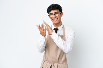 Restaurant Argentinian waiter isolated on white background applauding after presentation in a conference