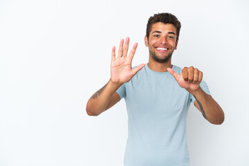 Fototapeta premium Young handsome Brazilian man isolated on white background counting six with fingers